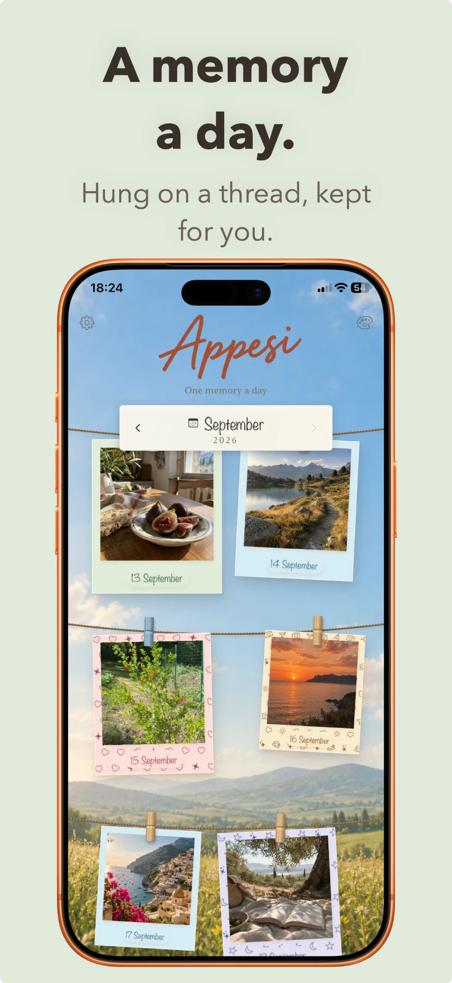 The main screen: the month’s photos pegged to three lines above a meadow.